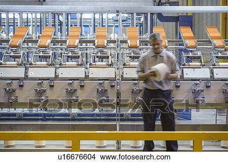 Workers examining thread in textile mill View Large Photo Image Picture - Workers examining thread in textile mill. Fotosearch