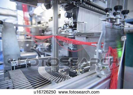 Yarn in threading machine in textile mill View Large Photo Image Stock Image - Yarn in threading machine in textile mill. Fotosearch