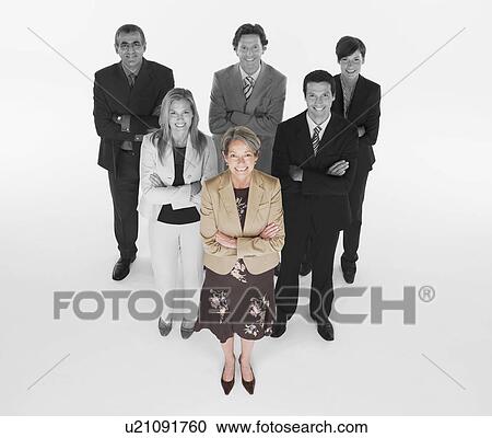 Ambitious businesswoman with team of professionals against white background View Large Photo Image Stock Image - Ambitious businesswoman with team of professionals against white background. Fotosearch