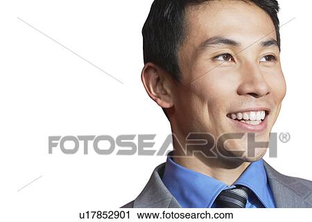Asian mid-adult businessman smiling against white background View Large Photo Image Stock Image - Asian mid-adult businessman smiling against white background. Fotosearch