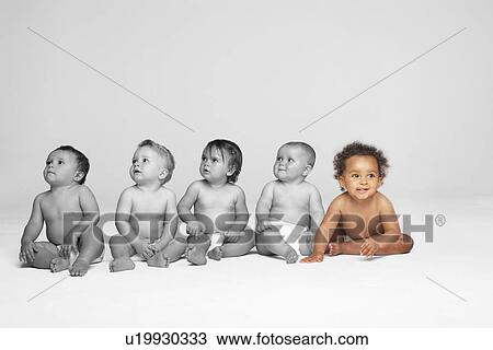 Baby girl with other babies looking away on floor View Large Photo Image Stock Image - Baby girl with other babies looking away on floor. Fotosearch