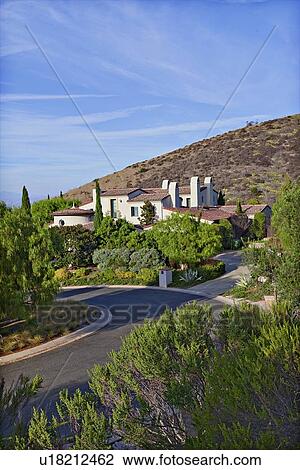 Beautiful house on a hill by a road View Large Photo Image Stock Image - Beautiful house on a hill by a road. Fotosearch