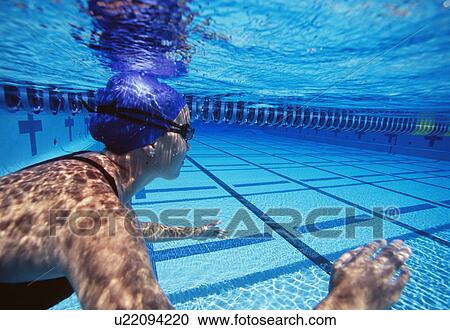 Caucasian female swimmers swimming in pool View Large Photo Image Stock Image - Caucasian female swimmers swimming in pool. Fotosearch
