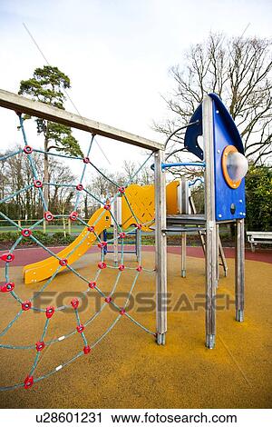 Stock Image - Climbing web with slide in background. Fotosearch