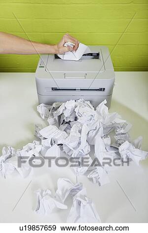 Cropped image of businessman's hand using printer with paper balls on desk View Large Photo Image Stock Photo - Cropped image of businessman's hand using printer with paper balls on desk. Fotosearch