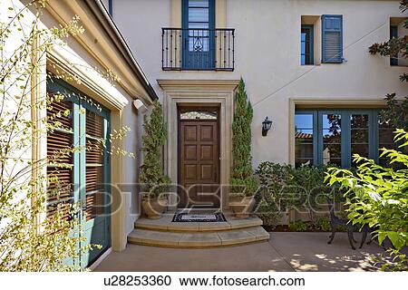 Entrance to a beautiful Mediterranean home exterior View Large Photo Image Stock Image - Entrance to a beautiful Mediterranean home exterior. Fotosearch