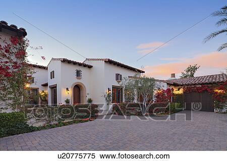 Stock Photography - Front entrance façade of luxury villa. Fotosearch