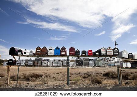 Stock Photo - Front view of rows of mailboxes in desert. Fotosearch