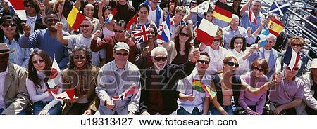 Happy group of people waving flags of different countries View Large Photo Image Stock Photo - Happy group of people waving flags of different countries. Fotosearch