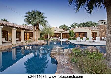 Stock Photograph - House Exterior with swimming pool. Fotosearch