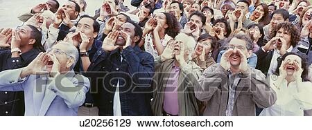 Panoramic shot of crowd shouting with hands on face View Large Photo Image Stock Photo - Panoramic shot of crowd shouting with hands on face. Fotosearch