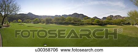 Stock Photograph - Panoramic view of a golf course. Fotosearch