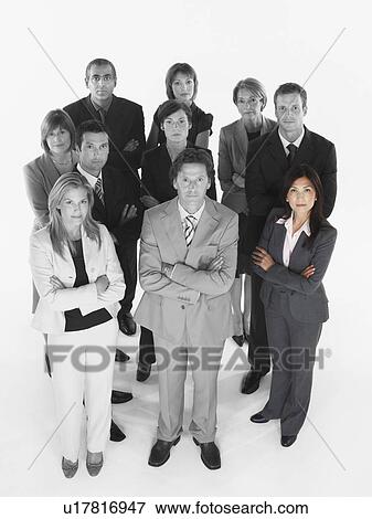 Portrait of confident business team standing with arms crossed against white background View Large Photo Image Stock Photo - Portrait of confident business team standing with arms crossed against white background. Fotosearch