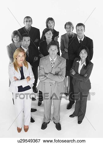 Portrait of confident business team standing with arms crossed against white background View Large Photo Image Stock Photo - Portrait of confident business team standing with arms crossed against white background. Fotosearch