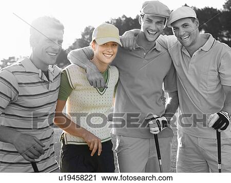 Stock Image - Portrait of four young friends at golf course. Fotosearch