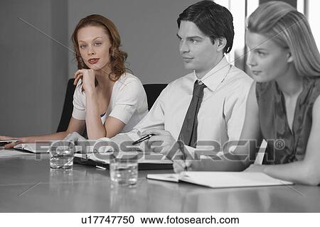 Portrait of young businesswoman with colleagues in a meeting View Large Photo Image Stock Image - Portrait of young businesswoman with colleagues in a meeting. Fotosearch