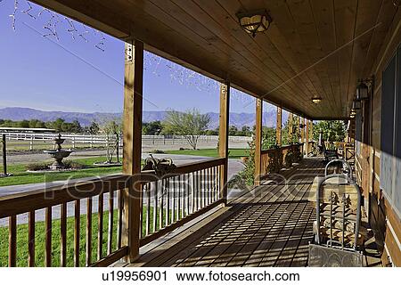 Ranch porch overlooking horse stables View Large Photo Image Stock Image - Ranch porch overlooking horse stables. Fotosearch