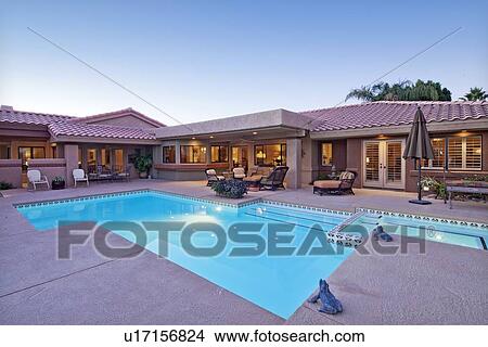 Rear view of luxury villa with swimming pool View Large Photo Image Picture - Rear view of luxury villa with swimming pool. Fotosearch