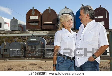 Senior couple stand in front of rural mailboxes View Large Photo Image Stock Image - Senior couple stand in front of rural mailboxes. Fotosearch
