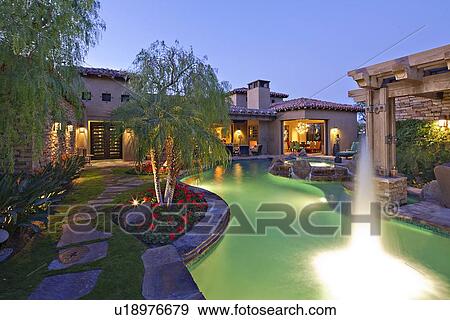 Shooting water outside House Exterior with swimming pool and hot tub View Large Photo Image Stock Photo - Shooting water outside House Exterior with swimming pool and hot tub. Fotosearch
