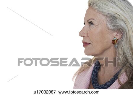 Stock Photo - Side view of pensive senior woman against white background. Fotosearch