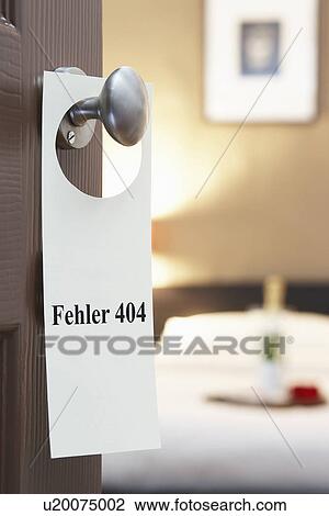 Stock Image - Sign with German text "Fehler 404" (error 404) hanging on hotel room door. Fotosearch