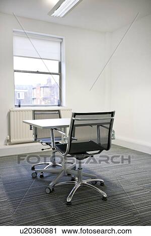 Stock Image - Small table sunny in office. Fotosearch