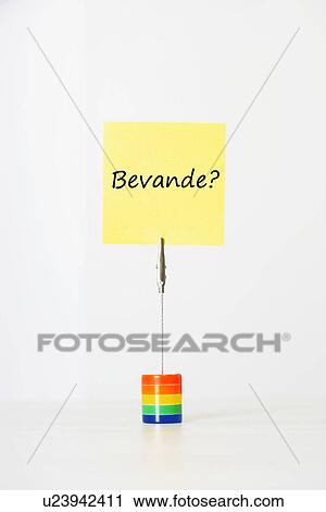 Stock Image - Sticky notepaper with Italian text "Bevande? " (drinks) clipped to a multicolored card holder. Fotosearch