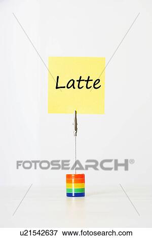 Stock Photo - Sticky notepaper with Italian text "latte" (milk) clipped to a multicolored card holder. Fotosearch