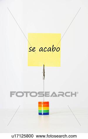Sticky notepaper with Spanish text "se acabo" (It's over) clipped to a multicolored card holder View Large Photo Image Stock Image - Sticky notepaper with Spanish text "se acabo" (It's over) clipped to a multicolored card holder. Fotosearch