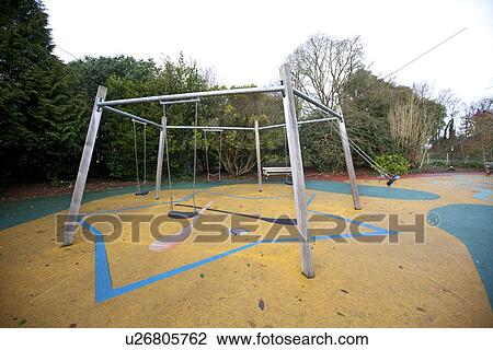 Swing set in a playground View Large Photo Image Stock Image - Swing set in a playground. Fotosearch