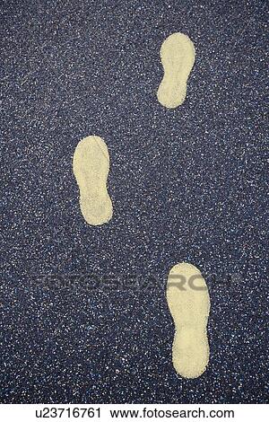 Yellow footsteps drawn in playground rubber flooring View Large Photo Image Stock Image - Yellow footsteps drawn in playground rubber flooring. Fotosearch