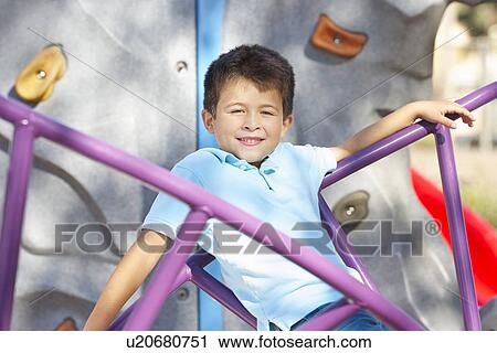 Boy On Climbing Frame In Park View Large Photo Image Stock Image - Boy On Climbing Frame In Park. Fotosearch