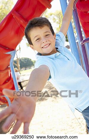 Boy On Climbing Frame In Park View Large Photo Image Stock Image - Boy On Climbing Frame In Park. Fotosearch