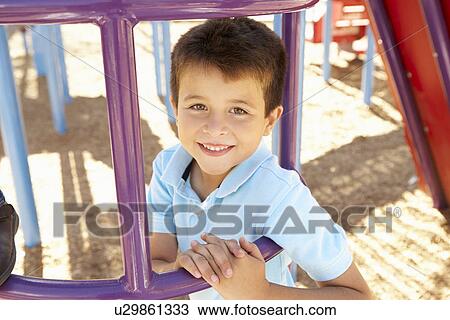 Boy On Climbing Frame In Park View Large Photo Image Stock Image - Boy On Climbing Frame In Park. Fotosearch