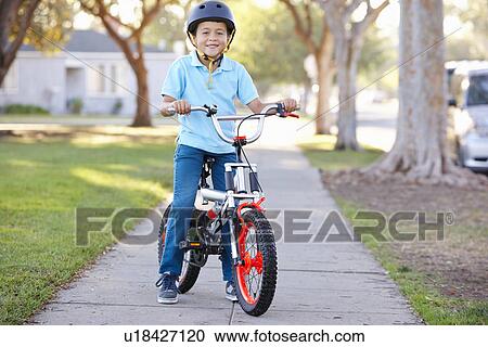 Boy Wearing Safety Helmet Riding Bike View Large Photo Image Stock Image - Boy Wearing Safety Helmet Riding Bike. Fotosearch