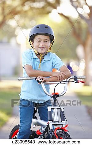 Boy Wearing Safety Helmet Riding Bike View Large Photo Image Stock Image - Boy Wearing Safety Helmet Riding Bike. Fotosearch