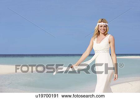 Stock Image - Bride At Beautiful Beach Wedding. Fotosearch