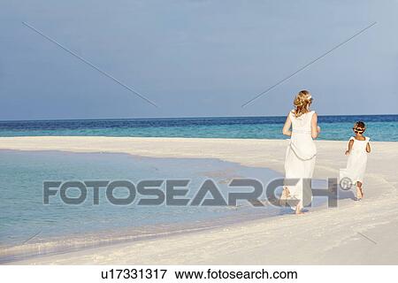 Bride With Bridesmaid At Beautiful Beach Wedding View Large Photo Image Stock Photo - Bride With Bridesmaid At Beautiful Beach Wedding. Fotosearch
