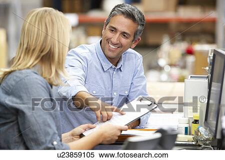 Business Colleagues Working At Desk In Warehouse View Large Photo Image Stock Photography - Business Colleagues Working At Desk In Warehouse. Fotosearch