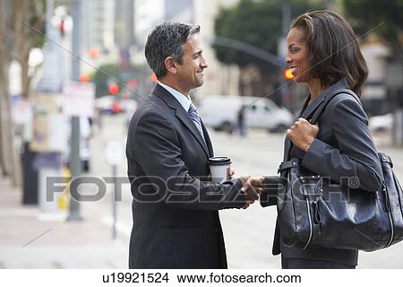 Businessman And Businesswoman Shaking Hands In Street View Large Photo Image Picture - Businessman And Businesswoman Shaking Hands In Street. Fotosearch