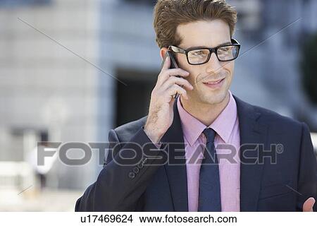 Businessman Outside Office On Mobile Phone View Large Photo Image Picture - Businessman Outside Office On Mobile Phone. Fotosearch