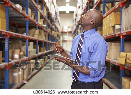 Businessman With Clipboard In Warehouse View Large Photo Image Stock Photograph - Businessman With Clipboard In Warehouse. Fotosearch