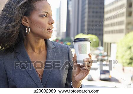 Businesswoman Drinking Takeaway Coffee Outside Office View Large Photo Image Stock Photo - Businesswoman Drinking Takeaway Coffee Outside Office. Fotosearch
