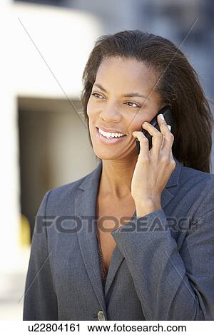 Businesswoman Outside Office On Mobile Phone View Large Photo Image Stock Image - Businesswoman Outside Office On Mobile Phone. Fotosearch