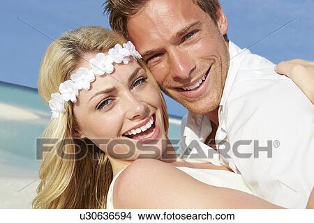 Picture - Couple At Beautiful Beach Wedding. Fotosearch