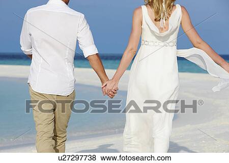 Couple At Beautiful Beach Wedding View Large Photo Image Stock Photo - Couple At Beautiful Beach Wedding. Fotosearch