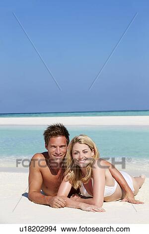 Picture - Couple Enjoying Beach Holiday. Fotosearch