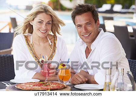 Couple Enjoying Meal In Outdoor Restaurant View Large Photo Image Picture - Couple Enjoying Meal In Outdoor Restaurant. Fotosearch