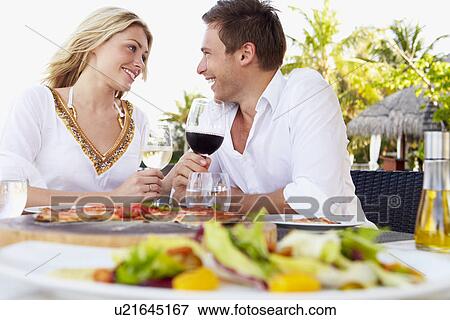 Couple Enjoying Meal In Outdoor Restaurant View Large Photo Image Stock Photo - Couple Enjoying Meal In Outdoor Restaurant. Fotosearch